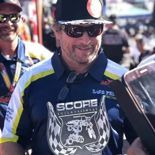 A picture of Jerry Curtis riding his motorcycle on the front of Florida Trail Riders magazine.